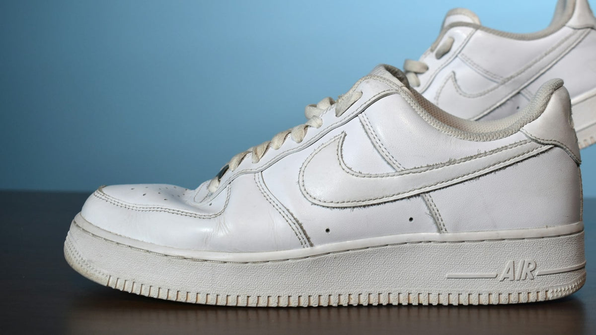 A white Nike Air Force 1 photographed from the side
