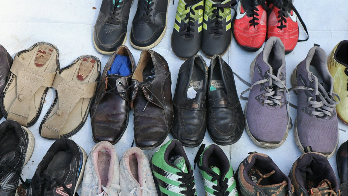 Rows of pre-loved sneakers lined up side by side