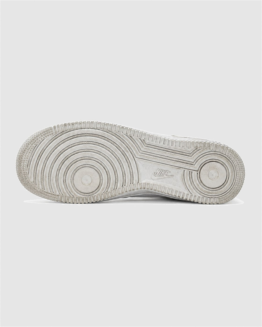 The outsole of a Triple White Nike Air Force 1